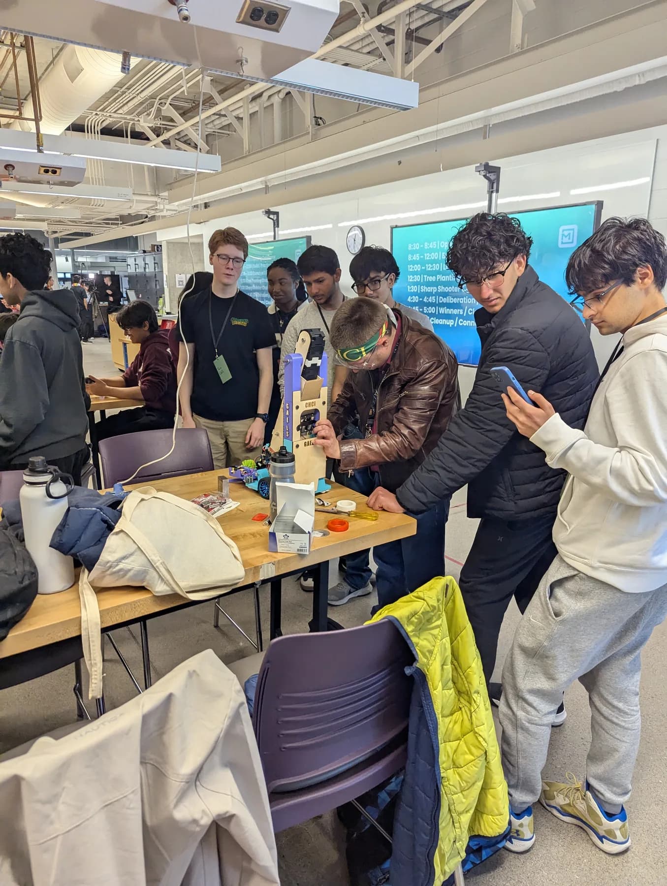 Cameron students making adjustments to their MechMania robot